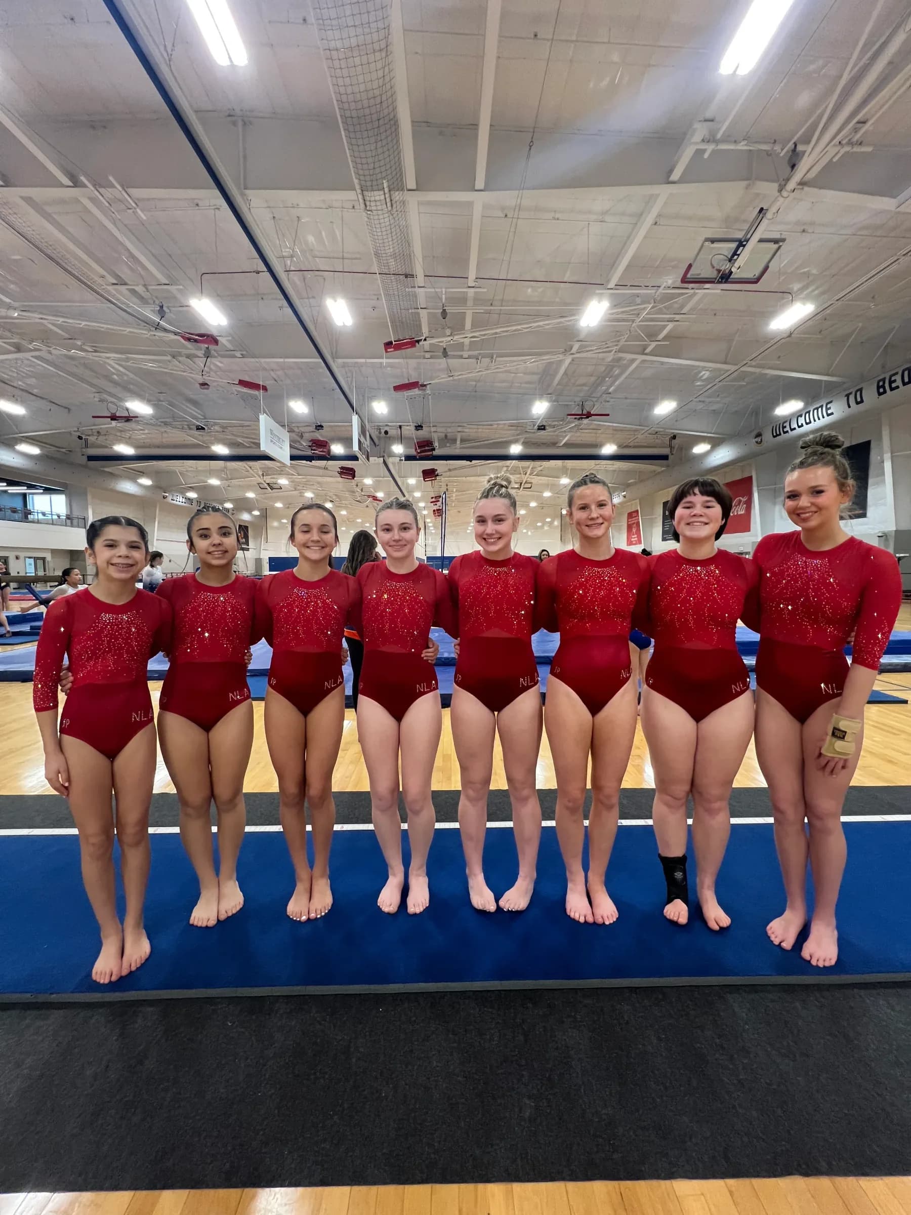 Young gymnastics athletes training together during unstructured gym time at Next Level Athletics